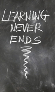 Learning Never Ends written in chalk on a blackboard style background